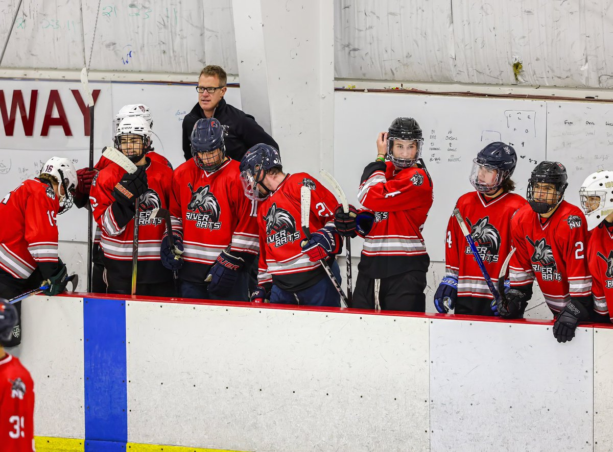River Rats players at the bench during a game